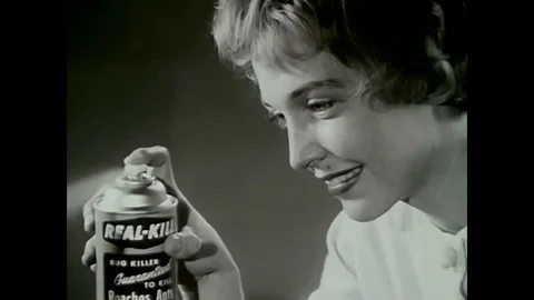 A woman in a 1964 TV commercial for bug spray has trouble getting the product to Stock Footage