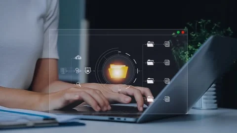 Woman accesses data information management with laptop on security cloud Stock Footage 325446248