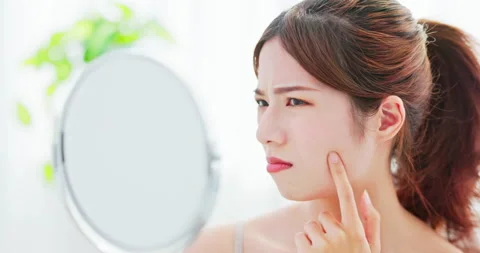 Woman with acne problem Stock Footage 194825974