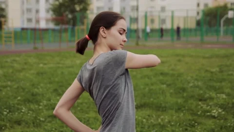 Woman actively warming up Stock Footage 135225477