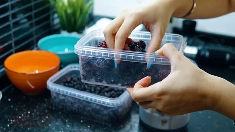 The woman adding the blueberrys	 Stock Footage 116765276