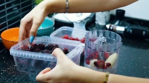 The woman adding the blueberrys	 Stock Footage 116765918