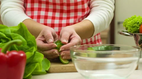 Woman Adding Cucumber Into Bowl, Preparing Vegetable Salad Stock Footage 46712930