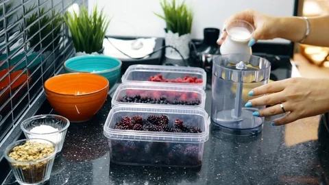 The woman adding the milk	 Stock Footage 116765110