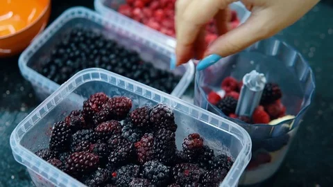 The woman adding the raspberry	 Stock Footage 116765775