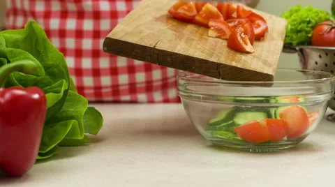 Woman Adding Tomato To The Vegetable Salad Stock Footage 46713129