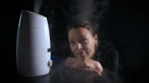 Woman by adorable diffuser. Stock Footage 287132182