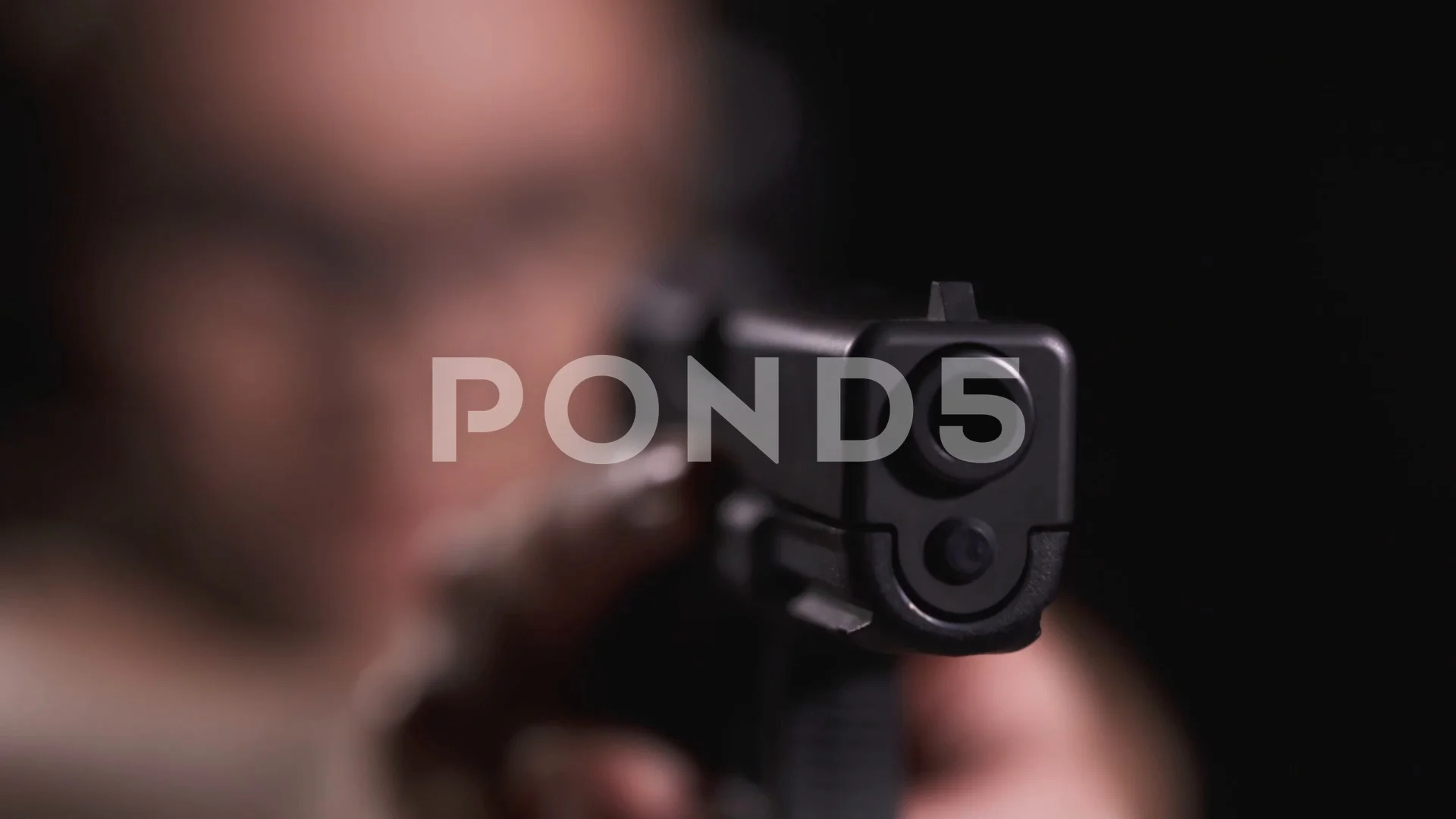 Woman is aiming with the gun in a shooti... | Stock Video | Pond5
