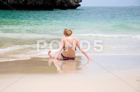 Woman Alone Sit On The Beach Looking Sea And Island