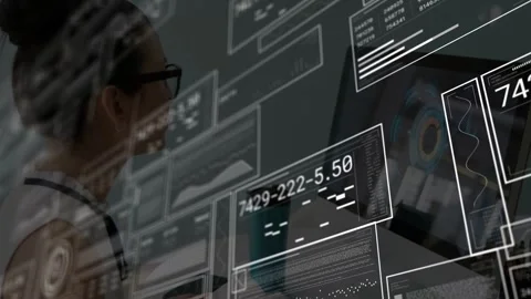 Woman analyst typing activating HUD panels showing graphs overlaying keys and Stock Footage 333444833