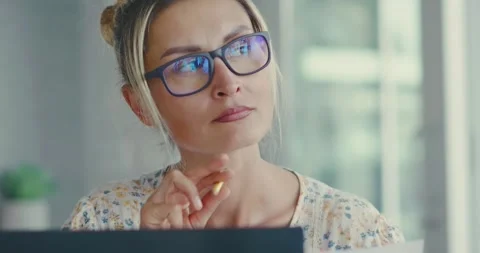 Woman Analyzing Documents at Office Desk Stock Footage 323585523