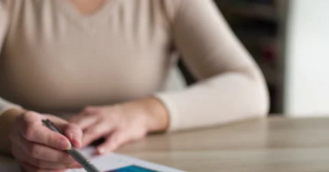 Woman analyzing financial data, looking at charts Stock Footage 48689650
