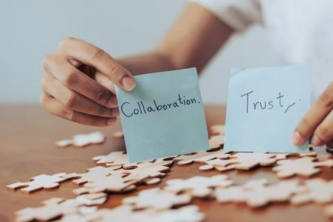 Woman analyzing notes on teamwork and trust while surrounded by colorful pu.. Stock Photos