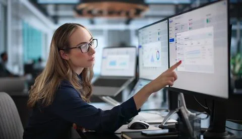 Woman Analyzing Payroll Data On Laptop To Ensure Salary Accuracy Today. Stock Photos