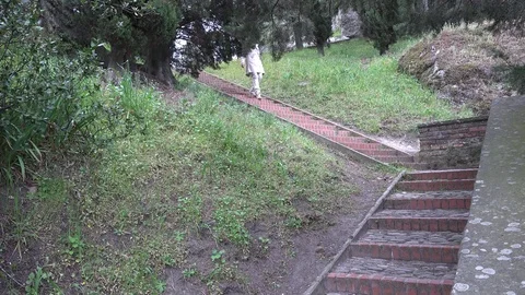 Woman on ancient stairs Stock Footage