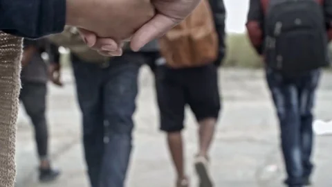 Woman and Child Holding Hands and Walking Stock Footage