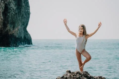 Yoga pose on one leg at the beach Royalty-Free Stock Image