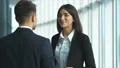 The woman and a man talk in the office center. slow motion 4k or 4k+ Resolution