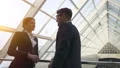 The woman and a man talking in the business center. slow motion HD Footage