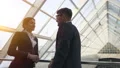 The woman and a man talking in the business center. slow motion 4k or 4k+ Resolution