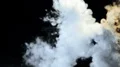 The woman and man walking in the dark through a smoke cloud. slow motion 4k or 4k+ Resolution