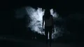 The woman and man walking through a smoke cloud in a dark background 4k or 4k+ Resolution