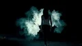 The woman and man walking through the smoke cloud in the dark background 4k or 4k+ Resolution