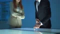 The woman and a man working with the virtual screen 4k or 4k+ Resolution