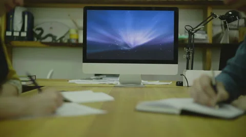 Woman and Man Writing Code For Ux on Paper. view4 Stock Footage 52243135