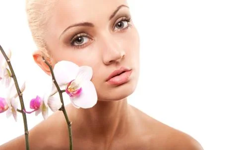 Woman and orchid Stock Photos