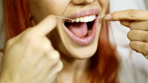 Woman and teeth floss 動画素材 59643657