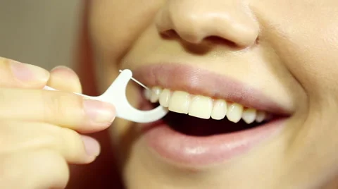 Woman and teeth floss 스톡 동영상 59643672