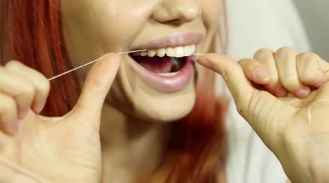 Woman and teeth floss  Stock Footage 59643783