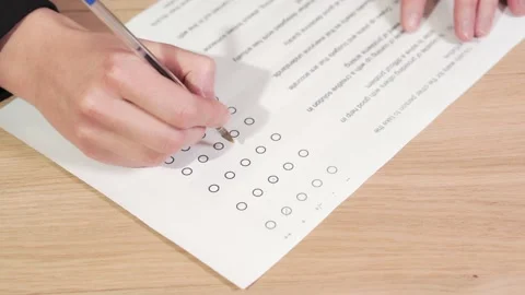 Woman answering the multiple response test in upon employment. Psychometric test Stockbeeldmateriaal 145992381