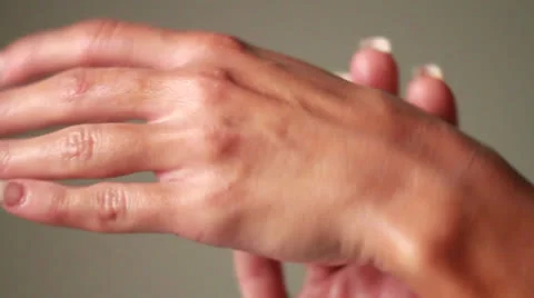 Woman Applies Sun Screen Tan Lotion by Messaging Her Hands Over Lady Body Parts Stock Footage