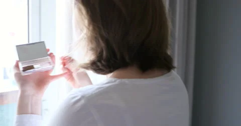Woman applying make-up Stock Footage