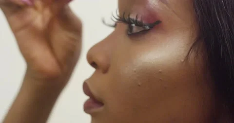 Woman applying make up Stock Footage 188559712