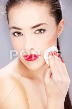 Woman applying make up Stock Photos