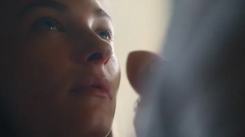 Woman applying makeup on a model Stock Footage 275337834