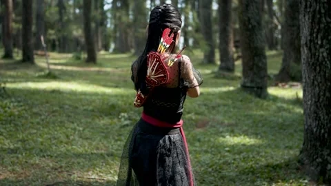Woman Archer Pulls Arrow and Walks Barefoot in Forest Stock Footage 334792210