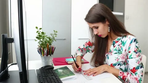 A woman, architect, interior designer is doing the technical drawing Stock Footage 157304544