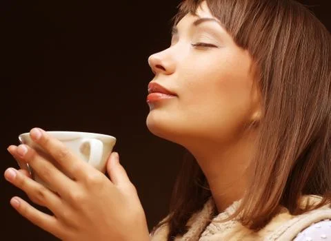 Woman with an aromatic coffee Stock Photos