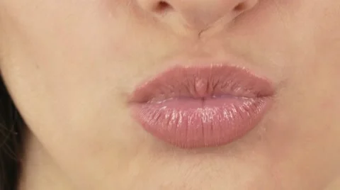 pursing lips