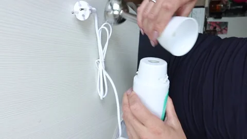 A woman is assembling an immersion blender. vertical video. Close-up. Stock Footage 247907188