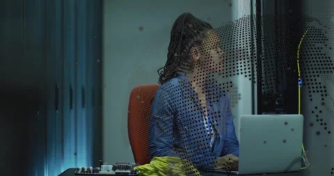 Woman assembling yellow network cables in technology lab, with animated data Stock Footage 309068707
