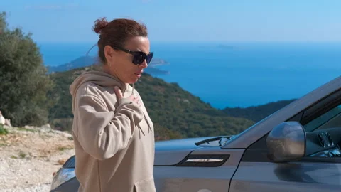 Woman with asthma attack using inhaler during road trip Stock Footage 325450191
