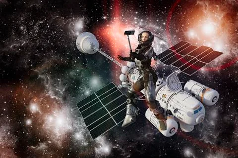 Woman astronaut posing for cell phone selfie during space walk Stock Photos