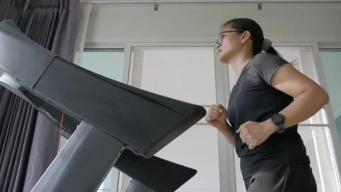 Woman athletic doing exercise on the treadmill with smartwatch. Stock Footage 170225157