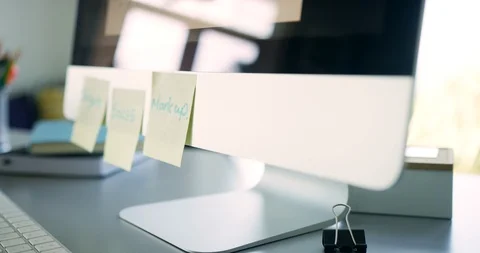 Woman Attaching Post It Notes To Computer Monitor In Office Stock Footage 100041142