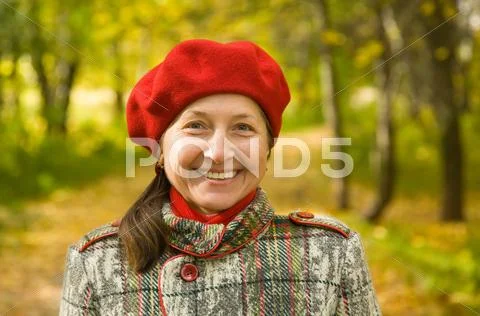 Woman in autumn park Stock Photos